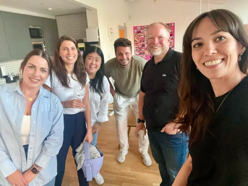 Attendees smiling together in Stockholm